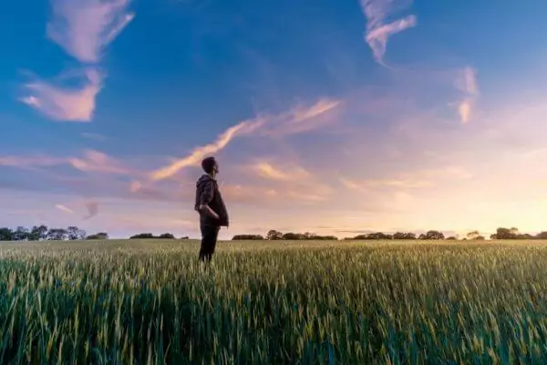 standing in field